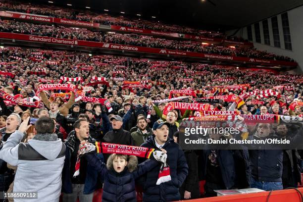 Liverpool fans sing You'll Never Walk Alone before the Premier League match between Liverpool FC and Everton FC at Anfield on December 4, 2019 in...