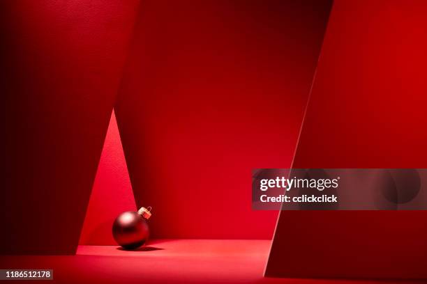 red christmas baubles in red background. - christmas celebrations in china stock pictures, royalty-free photos & images