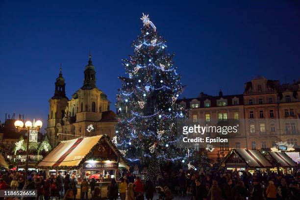General view of the illuminated Old Town Square with a Christmas tree at the Christmas market on December 4, 2019 in Prague, Czech Republic.