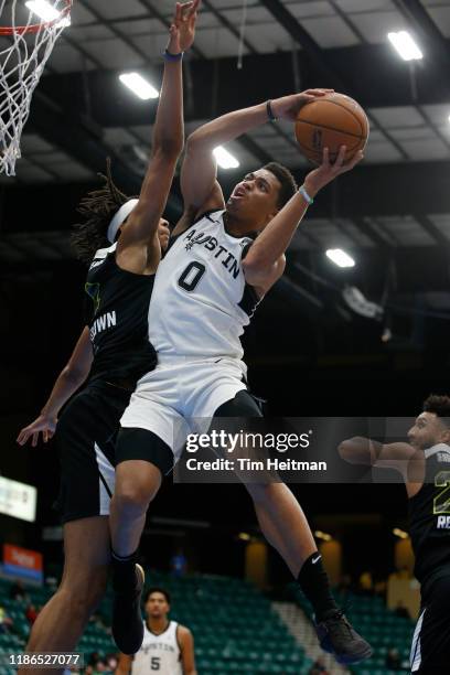 Keldon Johnson of the Austin Spurs drives on Moses Brown of the Texas Legends during the fourth quarter on December 4th, 2019 at Comerica Center in...