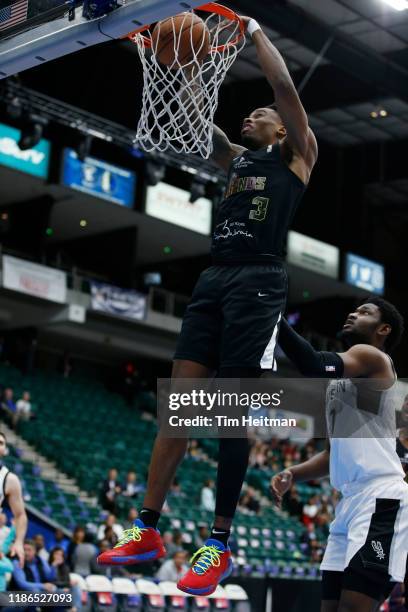 Antonius Cleveland of the Texas Legends dunks on Keldon Johnson of the Austin Spurs during the first quarter on December 4th, 2019 at Comerica Center...