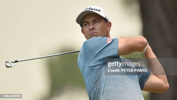 Australian golfer Adam Scott tees off at the 4th hole on day one of the Australian Open golf tournament in Sydney on December 5, 2019. / -- IMAGE...