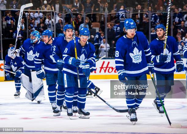 William Nylander, Alexander Kerfoot, Dmytro Timashov, Ilya Mikheyev, Tyson Barrie, and Frederik Andersen of the Toronto Maple Leafs celebrate...