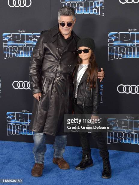 Esai Morales and Mariana Oliveira Morales arrive at the Premiere Of 20th Century Fox's "Spies In Disguise" at El Capitan Theatre on December 4, 2019...
