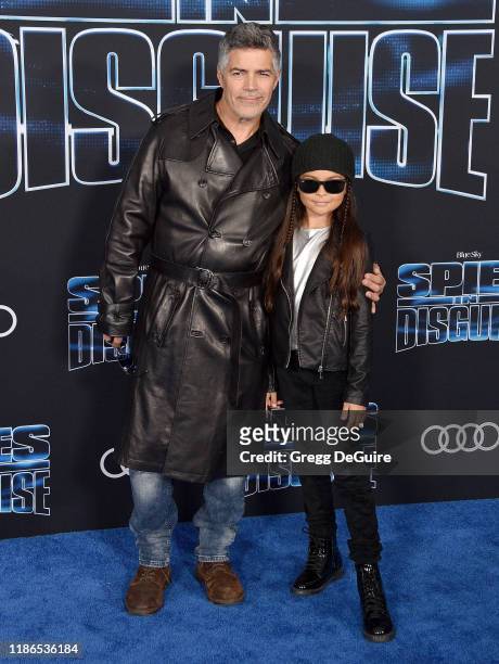 Esai Morales and Mariana Oliveira Morales arrive at the Premiere Of 20th Century Fox's "Spies In Disguise" at El Capitan Theatre on December 4, 2019...