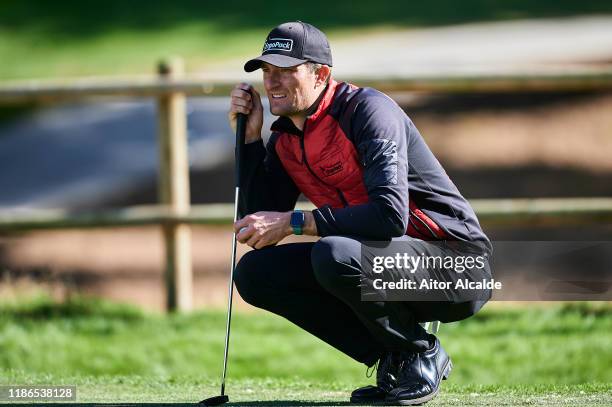 Sebastian Heisele of Germany prepares his putt on the 5th green during day 3 of the Challenge Tour Grand Final at Club de Golf Alcanada on November...