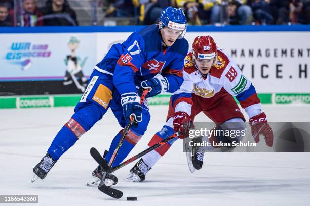 Samuel Bucek of Slovakia battles for possession with Ilia Karpukhin of Russia during the Deutschland Cup 2019 match between Russia and Slovakia at...