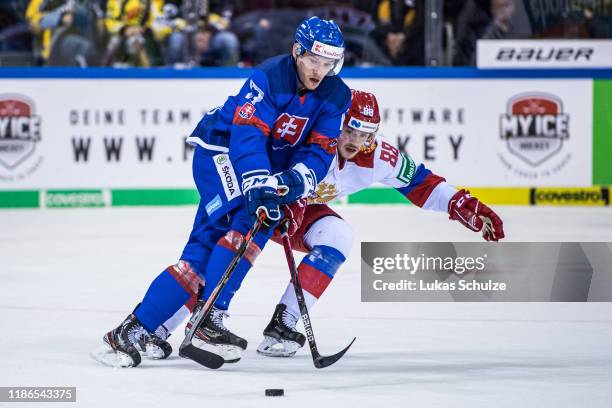 Samuel Bucek of Slovakia battles for possession with Ilia Karpukhin of Russia during the Deutschland Cup 2019 match between Russia and Slovakia at...