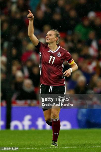 Alexandra Popp of Germany celebrates scoring the opening goal during the International Friendly between England Women and Germany Women at Wembley...