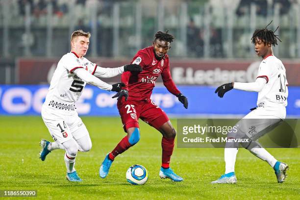 Benjamin Bourigeaud of Rennes and Adama Traore of Metz during the Ligue 1 match between FC Metz and Rennes at Stade Saint-Symphorien on December 4,...