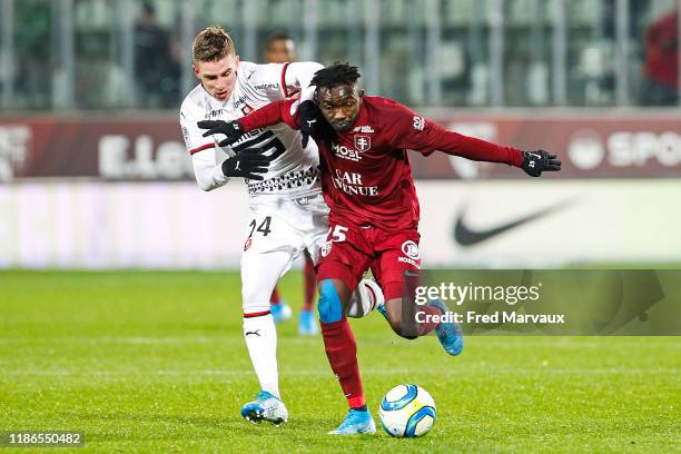 Benjamin Bourigeaud of Rennes and Adama Traore of Metz during the Ligue 1 match between FC Metz and Rennes at Stade Saint-Symphorien on December 4,...