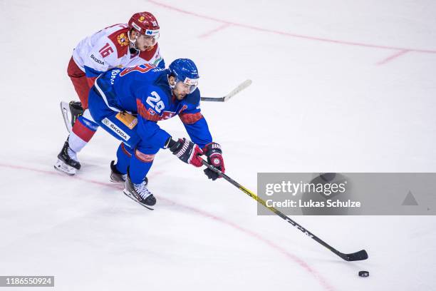 Vladislav Kodola of Russia battles for possession with Marek Hrivik of Slovakia during the Deutschland Cup 2019 match between Russia and Slovakia at...
