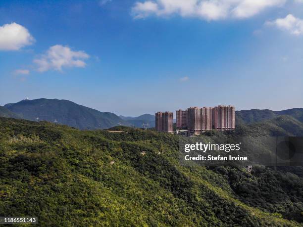 An aerial photograph taken above Happy Valley, Hong Kong, looking towards Parkview, a luxury residential complex above Tai Tam Country Park.