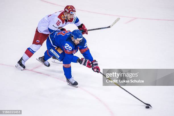 Vladislav Kodola of Russia battles for possession with Marek Hrivik of Slovakia during the Deutschland Cup 2019 match between Russia and Slovakia at...