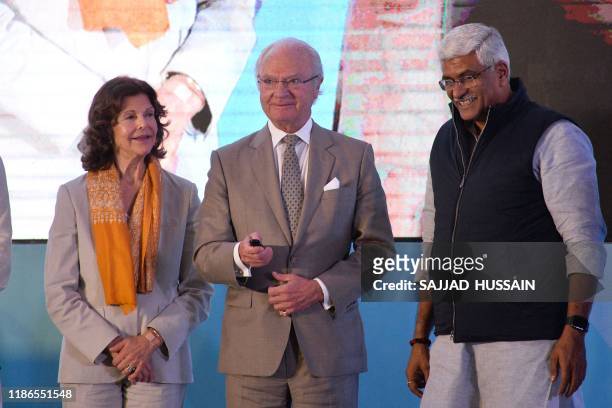 Sweden's King Carl XVI Gustaf inaugurates the Sarai sewage treatment plant as Queen Silvia looks on in Haridwar on December 5, 2019.