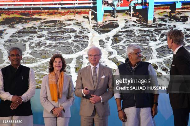 Sweden's King Carl XVI Gustaf inaugurates the Sarai sewage treatment plant as Queen Silvia looks on in Haridwar on December 5, 2019.