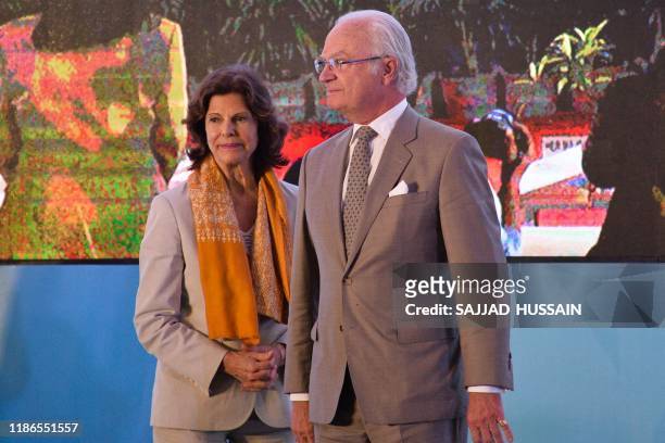 Sweden's King Carl XVI Gustaf and Queen Silvia arrive to inaugurate the Sarai sewage treatment plant in Haridwar on December 5, 2019.