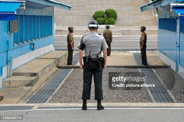 December 2019, South Korea, Paju: A South Korean soldier guards the border with North Korea. He's in Panmunjom on the South Korean side. There are...