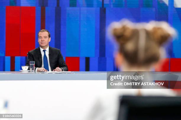 Russian Prime Minister Dmitry Medvedev gives a live interview on the annual results of the government work to journalists of Russia's television...