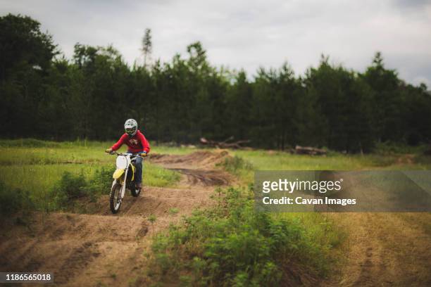teen boy on dirtbike trike in northwestern, wi - motorcross stock pictures, royalty-free photos & images
