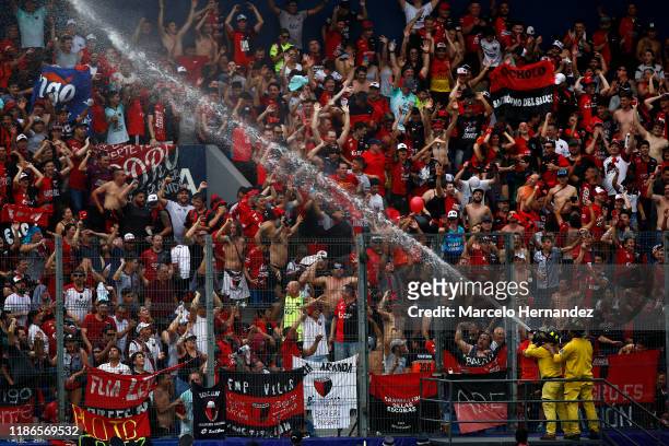 Firefighters use their hose to spray water to fans due to high temperatures before the final of Copa CONMEBOL Sudamericana 2019 between Colon and...
