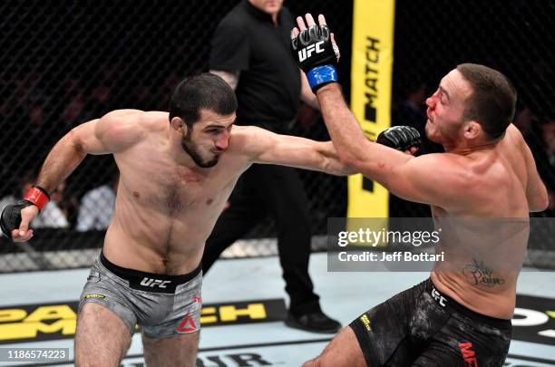 Ramazan Emeev of Russia punches Rocco Martin in their welterweight bout during the UFC Fight Night event at CSKA Arena on November 09, 2019 in...