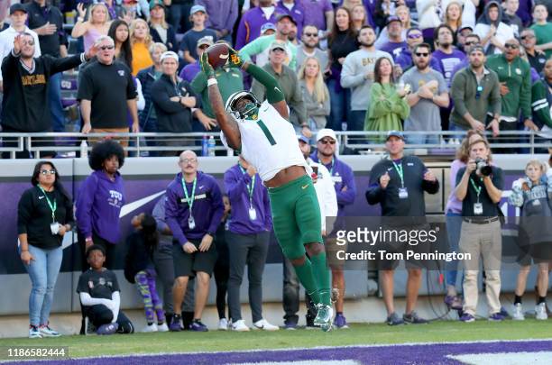 Grayland Arnold of the Baylor Bears intercepts a pass in the end zone against the TCU Horned Frogs to end the game 29-23 in triple overtime at Amon...