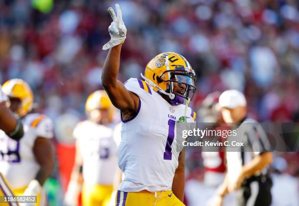 Ja'Marr Chase of the LSU Tigers celebrates scoring a 33-yard receiving touchdown during the first quarter against the Alabama Crimson Tide in the...