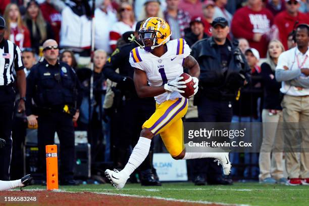 Ja'Marr Chase of the LSU Tigers scores a 33-yard receiving touchdown during the first quarter against the Alabama Crimson Tide in the game at...