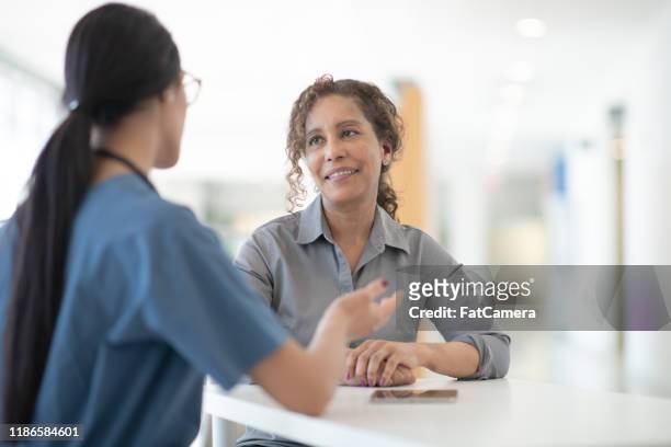 doctor meeting with senior patient stock photo - diabetes care stock pictures, royalty-free photos & images