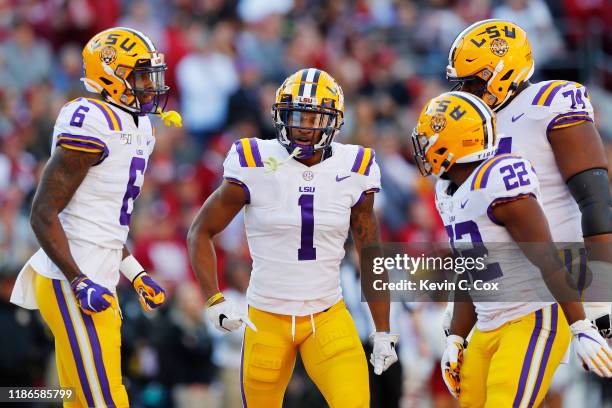 Ja'Marr Chase of the LSU Tigers celebrates with teammates after scoring a 33-yard receiving touchdown during the first quarter against the Alabama...