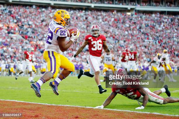 Clyde Edwards-Helaire of the LSU Tigers catches a 13-yard touchdown pass during the second quarter against the Alabama Crimson Tide in the game at...