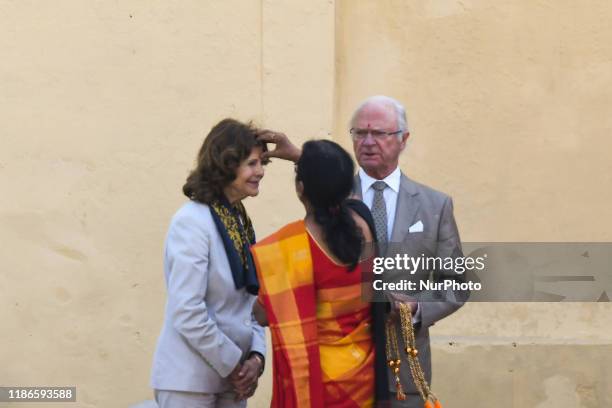 Sweden's King Carl XVI Gustaf and Queen Silvia attend a Ganga Arti Puja, a prayer service, on the banks of the Ganga river in Rishikesh, Uttarakhand,...