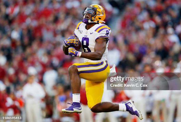 Patrick Queen of the LSU Tigers celebrates after intercepting a pass during the second quarter against the Alabama Crimson Tide in the game at...