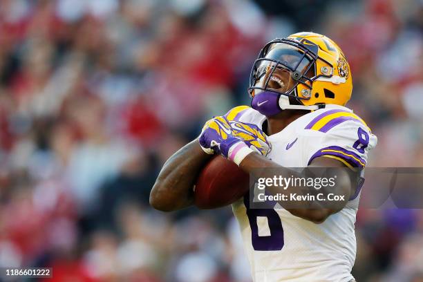 Patrick Queen of the LSU Tigers celebrates after intercepting a pass during the second quarter against the Alabama Crimson Tide in the game at...