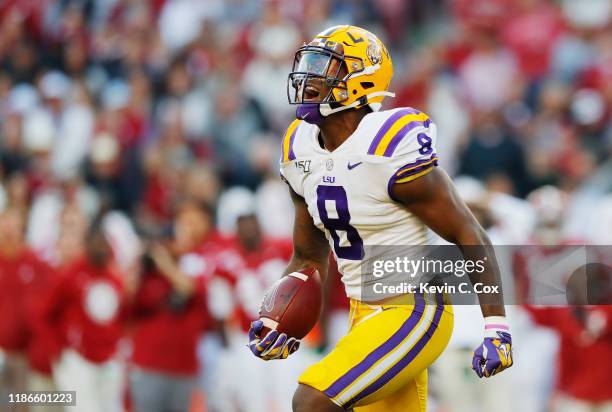 Patrick Queen of the LSU Tigers celebrates after intercepting a pass during the second quarter against the Alabama Crimson Tide in the game at...