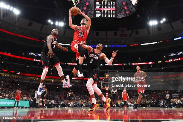 Tomas Satoransky of the Chicago Bulls drives to the basket against Russell Westbrook of the Houston Rockets during the second half of a game at...