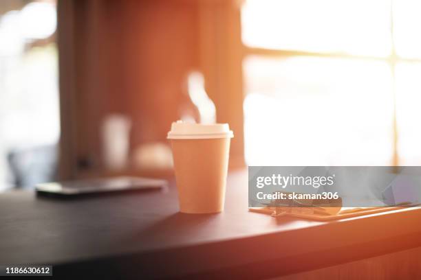 close up ice coffee cup in wooden table and copy space - arabica coffee drink stock pictures, royalty-free photos & images