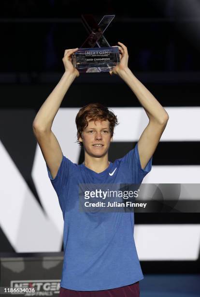 Jannik Sinner of Italy celebrates with the winners trophy after defeating Alex de Minaur of Australia in the final during Day Five of the Next Gen...