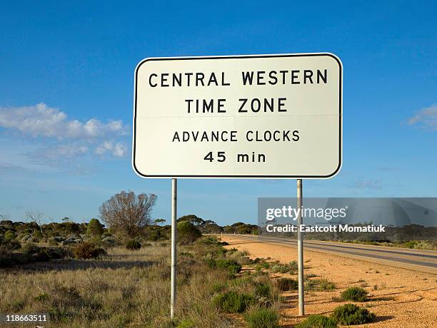 45 minute time zone signs, nullabor, australia - time zone stock pictures, royalty-free photos & images