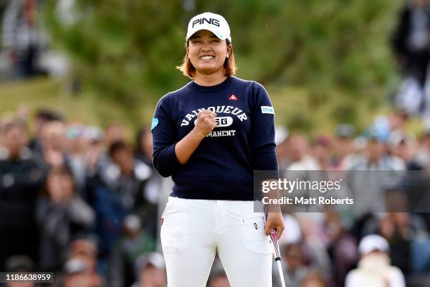 Ai Suzuki of Japan celebrates winning the tournament on the 18th green during the final round of the TOTO Japan Classic at Seta Golf Course North...