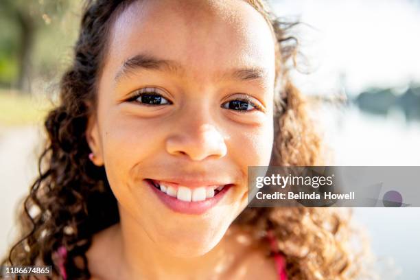 australian family in their backyard spend time together at sunrise - kiss face stock pictures, royalty-free photos & images