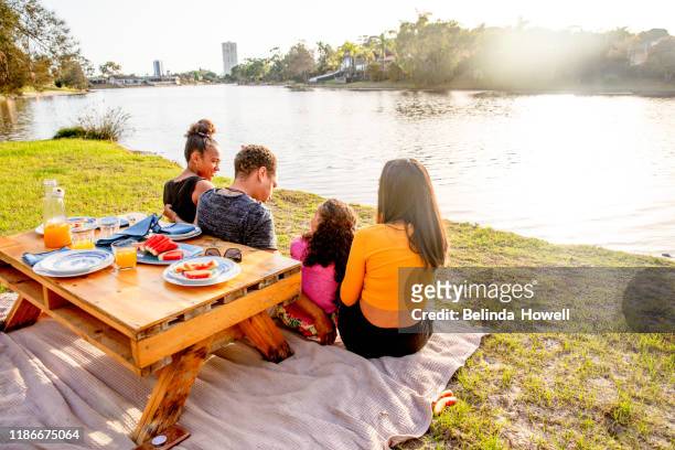 australian family in their backyard spend time together at sunrise - australian family time stock-fotos und bilder
