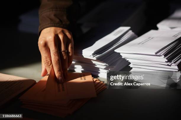 People take ballots for casting their vote at a polling station on November 10, 2019 in Barcelona, Spain. Spain holds its fourth general election in...