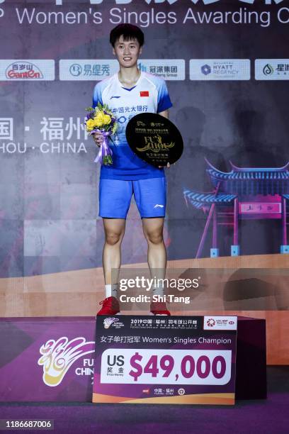 Chen Yufei of China poses with her trophy after the Women's Single final match against Nozomi Okuhara of Japan on day six of the Fuzhou China Open at...