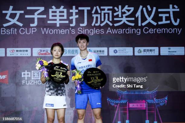 Chen Yufei of China and Nozomi Okuhara pose with their trophies after the Women's Single final match on day six of the Fuzhou China Open at Haixia...