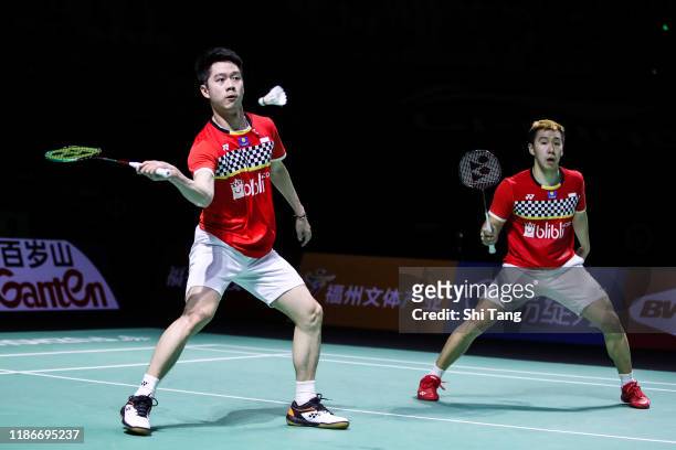 Marcus Fernaldi Gideon and Kevin Sanjaya Sukamuljo of Indonesia compete in the Men's Double final match against Takeshi Kamura and Keigo Sonoda of...