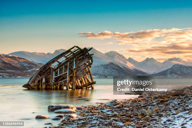 shipwreck on shore in tisnes, norway - olden norway stock pictures, royalty-free photos & images