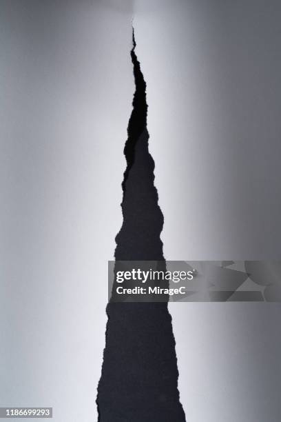 black fissure of torn paper - colour separation stock pictures, royalty-free photos & images