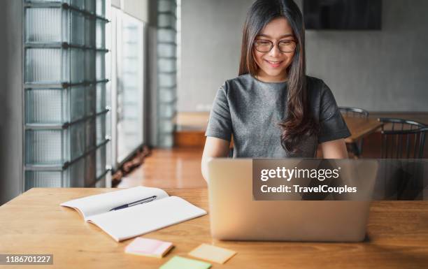 back to school education knowledge college university concept. business woman using laptop at cafe. young beautiful girl sitting in a coffee shop and working on computer. e - commerce, university education, internet technology - e learning asian stock pictures, royalty-free photos & images